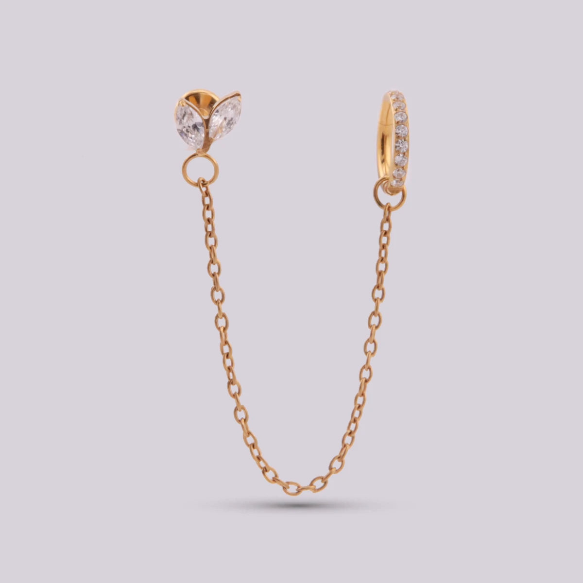 Pendiente con dos piercing