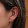 Joya con diseño de estrella en oro y esmeralda colombiana - Helix Body Jewelry - Tienda Online de Piercings
